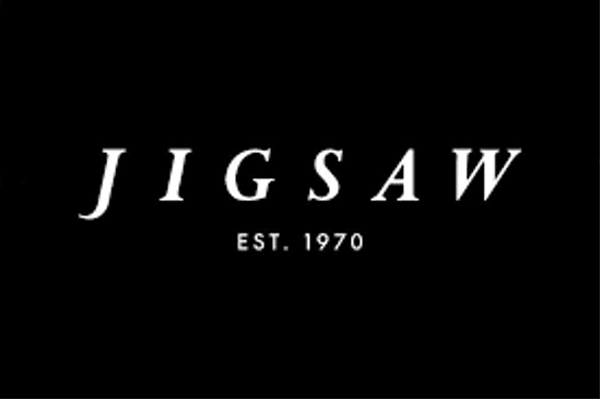 Black background with the word "JIGSAW" in white, capital letters. Below, the text "EST. 1970" is centered in smaller white font.