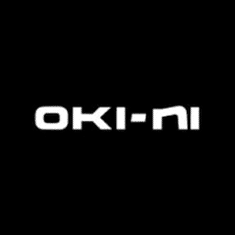 The image displays the word "OKI-NI" in white capital letters on a black background.