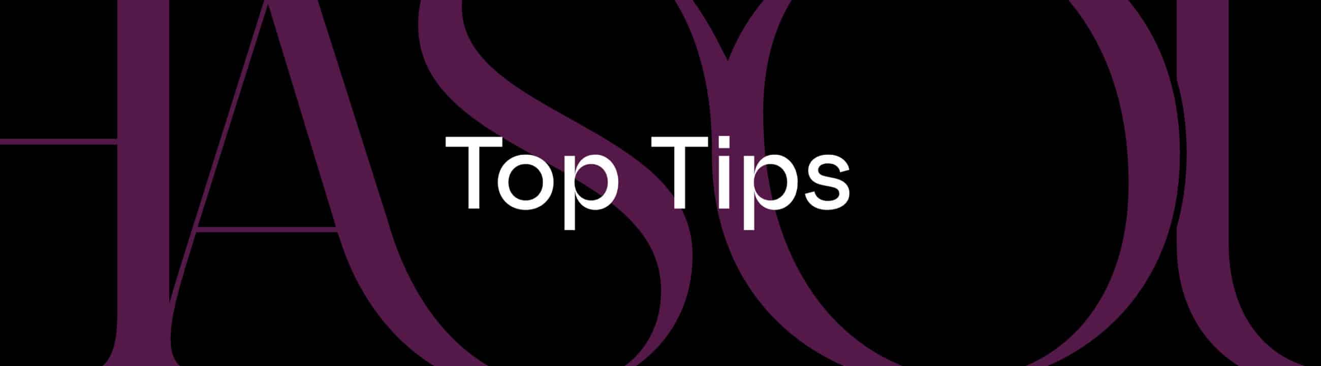 White text reading "Top Tips" is centered on a black background with large, partially visible purple letters in the background.